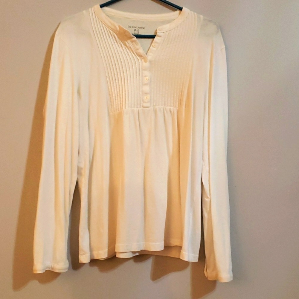 An all white blouse with ruffles. By Liz Claiborne. Size XL.